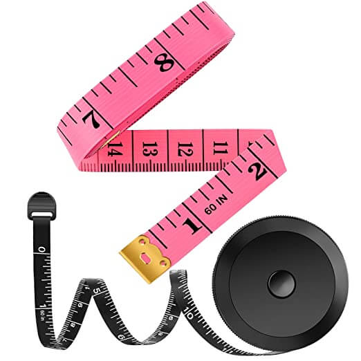 One pink measuring tape, ready to measure knitting, and another black retractable tape measure.